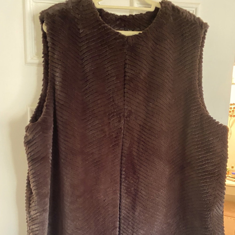 Cute faux fur vest. Chevron design. Never worn.